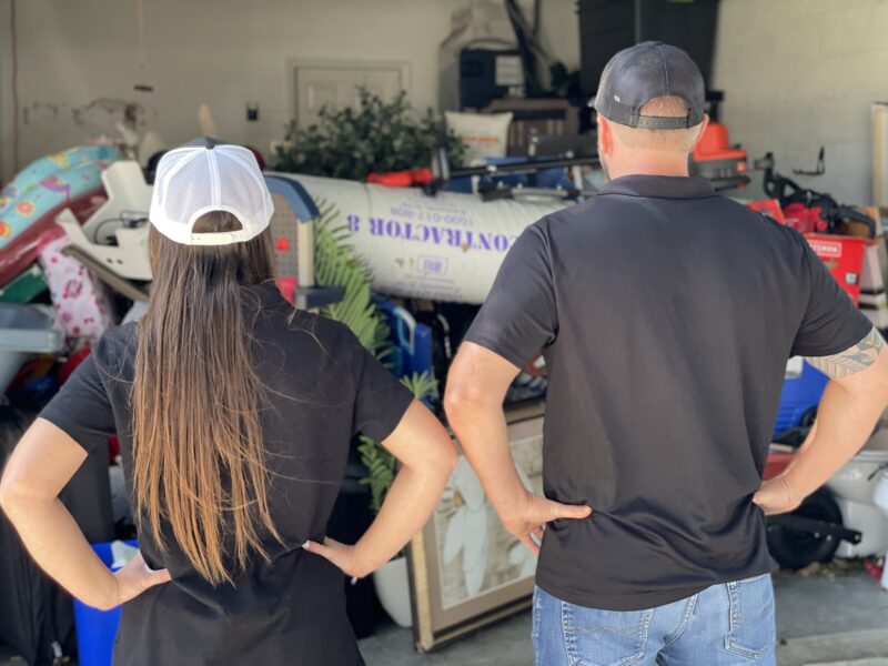 Lightning Bay Junk Man and Woman Facing Junks